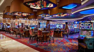 Filipino player browsing the winph5 Game Lobby on a mobile phone showing live casino and slot categories